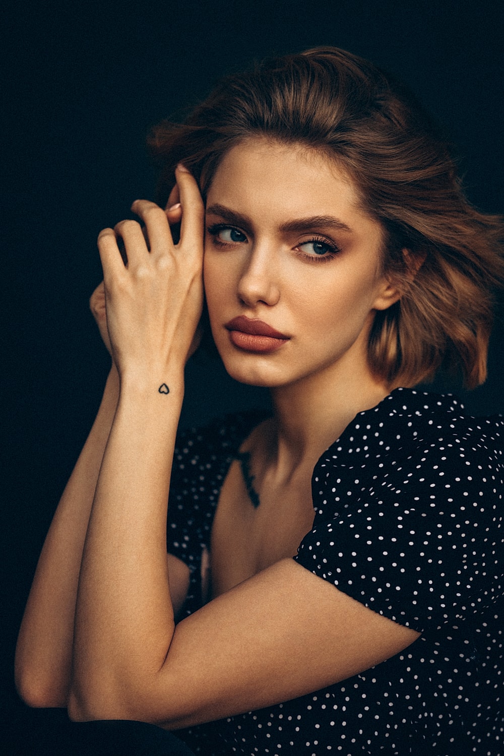 Portrait of a woman with stylish hair and makeup.